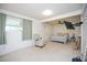 Spacious carpeted bedroom with ceiling fan and a mounted television on the wall at 10018 N 97Th Dr # A, Peoria, AZ 85345