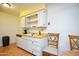 Functional kitchen area with plenty of counter space and open shelving for easy access at 10018 N 97Th Dr # A, Peoria, AZ 85345