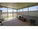 Covered patio with a table, barbeque, and screened windows at 10018 N 97Th Dr # A, Peoria, AZ 85345