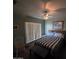 Cozy bedroom featuring neutral colors, a queen-sized bed, and a ceiling fan for a peaceful atmosphere at 1032 E Sheffield Ave, Chandler, AZ 85225