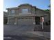 Charming two-story home with a three-car garage, landscaped front yard, and tile roof at 1032 E Sheffield Ave, Chandler, AZ 85225