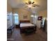 Spacious main bedroom with vaulted ceilings, large windows, and a king-sized bed for comfortable living at 1032 E Sheffield Ave, Chandler, AZ 85225
