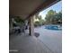 Relaxing outdoor patio space next to the pool, featuring seating and a heater for all-weather enjoyment at 1032 E Sheffield Ave, Chandler, AZ 85225