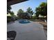 Backyard featuring a refreshing pool surrounded by lush landscaping and a patio area at 1032 E Sheffield Ave, Chandler, AZ 85225