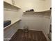 Organized walk-in closet with ample shelving and storage space for clothes and accessories at 1032 E Sheffield Ave, Chandler, AZ 85225