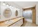 Bright bathroom features dual sinks with modern fixtures, neutral walls and tile floors at 1044 N Abner --, Mesa, AZ 85205