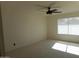 Neutral bedroom features carpeting, overhead fan, and a bright window at 1044 N Abner --, Mesa, AZ 85205