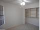 Bedroom featuring neutral carpet, white walls, a window and closet with adjustable shelves and storage at 1044 N Abner --, Mesa, AZ 85205
