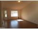 Sunlit bedroom with tile floors, neutral walls, and large window at 1044 N Abner --, Mesa, AZ 85205