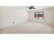 Inviting bedroom with ceiling fan, plush carpet, and views of the backyard pool at 1044 N Abner --, Mesa, AZ 85205