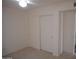 Bedroom featuring neutral carpet, white walls, a closet with sliding doors and entry doorway at 1044 N Abner --, Mesa, AZ 85205