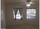 Bedroom with neutral carpet and white walls features two windows, a ceiling fan and electrical outlets at 1044 N Abner --, Mesa, AZ 85205