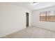 Bright bedroom with neutral carpet, a closet, and a window offering natural light at 1044 N Abner --, Mesa, AZ 85205