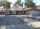 Well-maintained home featuring desert landscaping, mature trees and an attached garage at 1044 N Abner --, Mesa, AZ 85205