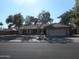 Charming single Gathering home with mature trees, a two-car garage, and desert landscaping at 1044 N Abner --, Mesa, AZ 85205