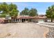 Well-maintained single-story home with desert landscaping and a red tile roof on a sunny day at 1044 N Abner --, Mesa, AZ 85205