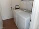 Bright laundry room features a white washer and dryer with door to the outside at 1044 N Abner --, Mesa, AZ 85205
