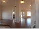 Inviting living room with tile flooring, natural light, and open archway to the kitchen at 1044 N Abner --, Mesa, AZ 85205