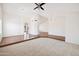 Spacious living area with tile entry, plush carpeting, and an open floor plan at 1044 N Abner --, Mesa, AZ 85205