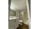 Bathroom featuring a shower, white vanity, and updated fixtures at 10828 N Biltmore Dr # 133, Phoenix, AZ 85029