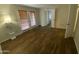 Bedroom with hardwood floors, large windows, and access to a private outdoor space at 10828 N Biltmore Dr # 133, Phoenix, AZ 85029