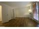 Bedroom with hardwood floors, large windows, and an open closet space at 10828 N Biltmore Dr # 133, Phoenix, AZ 85029