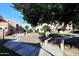 View of desert landscaping, a small wooden bridge and walkways between apartment buildings at 10828 N Biltmore Dr # 133, Phoenix, AZ 85029