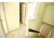 A hallway leads to a bedroom and stairs at 10828 N Biltmore Dr # 133, Phoenix, AZ 85029