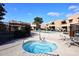 Hot tub with seating is surrounded by lush landscaping at 10828 N Biltmore Dr # 133, Phoenix, AZ 85029
