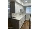 Updated kitchen with white cabinets, stainless steel appliances, and marble countertops at 10828 N Biltmore Dr # 133, Phoenix, AZ 85029