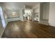 Open-concept living room and kitchen with stainless steel appliances and modern white cabinetry at 10828 N Biltmore Dr # 133, Phoenix, AZ 85029
