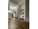 Bright living room with hardwood floors adjacent to a modern kitchen with stainless appliances at 10828 N Biltmore Dr # 133, Phoenix, AZ 85029