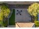 Aerial view of the backyard featuring a patio, artificial grass, and desert landscaping at 13330 W Milton Dr, Peoria, AZ 85383
