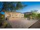 A large brick paver patio offers outdoor seating with a manicured backyard at 13330 W Milton Dr, Peoria, AZ 85383
