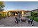Large patio with outdoor seating including a fire pit and artificial turf at 13330 W Milton Dr, Peoria, AZ 85383