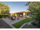 Well-maintained backyard with brick patio, green lawn, and neatly trimmed landscaping at 13330 W Milton Dr, Peoria, AZ 85383