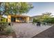 Large brick patio featuring an outdoor dining set and backyard at 13330 W Milton Dr, Peoria, AZ 85383