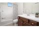 This bathroom has a tub shower combination and a vanity with a wood cabinet at 13330 W Milton Dr, Peoria, AZ 85383
