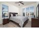 The bedroom has wood floors, plantation shutters, and an attractive bed frame at 13330 W Milton Dr, Peoria, AZ 85383