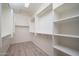 The walk-in closet has built in shelving and storage for all your wardrobe needs at 13330 W Milton Dr, Peoria, AZ 85383