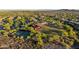 Birds eye view of the community clubhouse, tennis courts, pool and verdant landscape at 13330 W Milton Dr, Peoria, AZ 85383