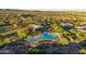 Gorgeous aerial view of the sparkling community pool and surrounding desert landscape at 13330 W Milton Dr, Peoria, AZ 85383