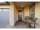 Charming front entryway featuring a cozy seating area and desert landscaping at 13330 W Milton Dr, Peoria, AZ 85383