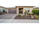 Charming one-story home featuring desert landscaping and a brick driveway at 13330 W Milton Dr, Peoria, AZ 85383