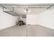 Spacious garage with epoxy flooring and installed overhead storage racks at 13330 W Milton Dr, Peoria, AZ 85383