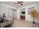 The living room has wood floors, a ceiling fan, and a built-in cabinet at 13330 W Milton Dr, Peoria, AZ 85383