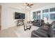 Open concept living room with a large screen television and comfortable seating at 13330 W Milton Dr, Peoria, AZ 85383
