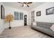 The living room has wood floors, a ceiling fan, and a sliding door closet at 13330 W Milton Dr, Peoria, AZ 85383