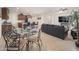 Open-concept living space featuring the kitchen, dining area, and living room with tile floors at 13330 W Milton Dr, Peoria, AZ 85383