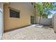 A low maintenance backyard features decorative rocks, desert landscaping, and a small patio at 1367 S Country Club Dr # 1221, Mesa, AZ 85210